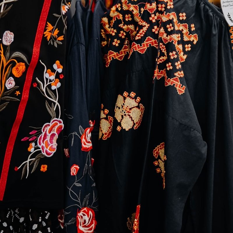 a group of black and red dresses